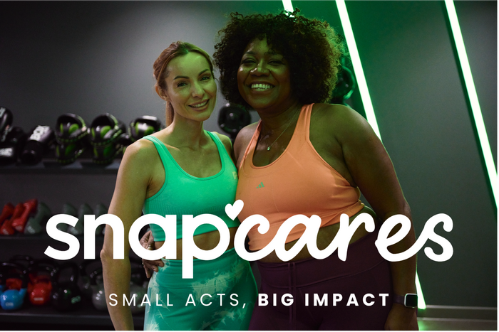 Two smiling women in gym, Snap Cares