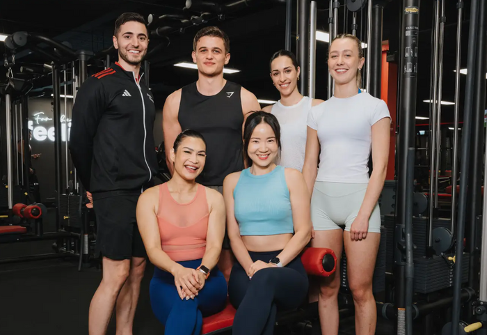 Snap Fitness 24/7 gym - smiling Snap Fitness team and members in 24/7 gym